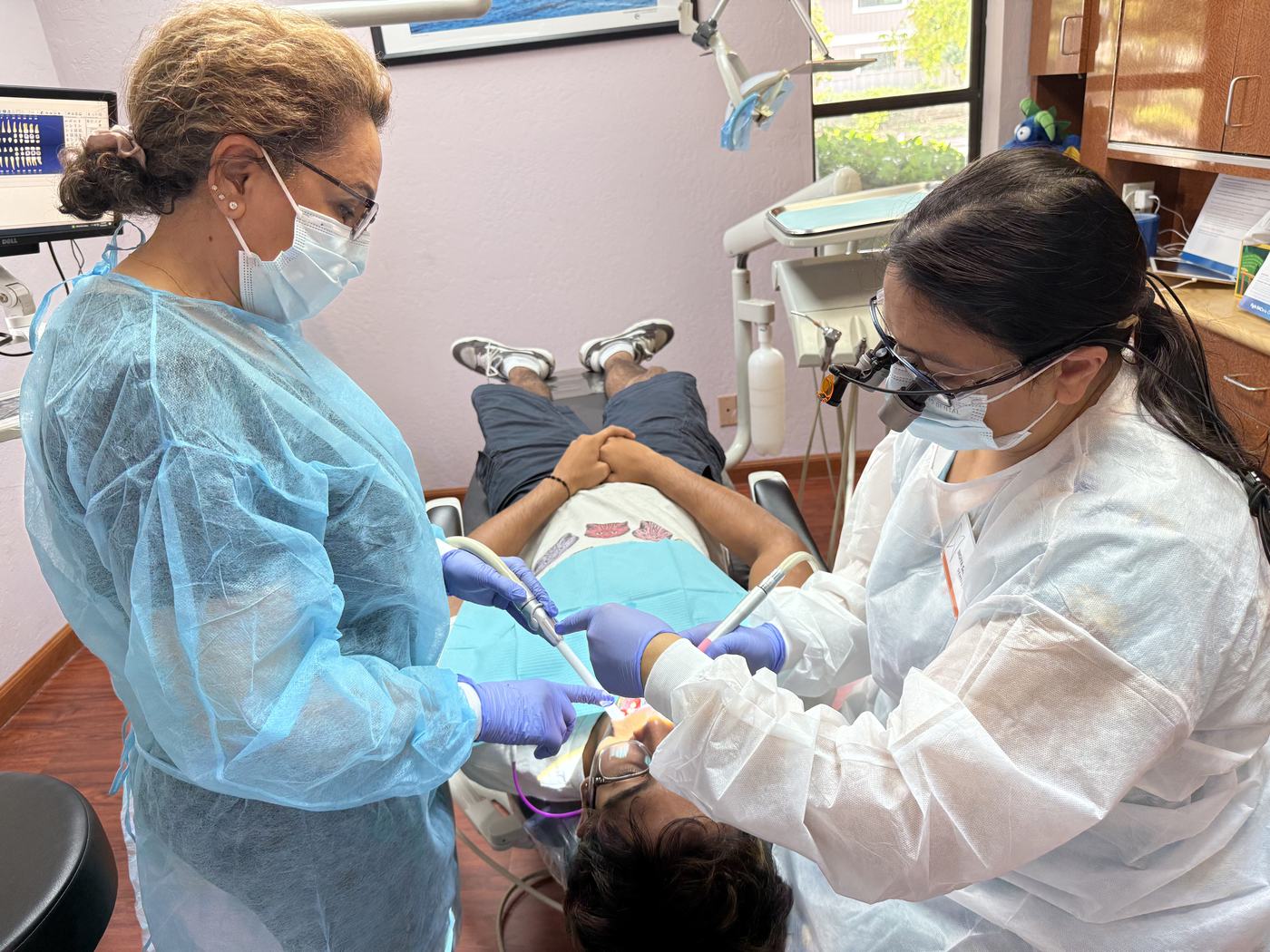 Dr. Saboowala and her assistant working together
