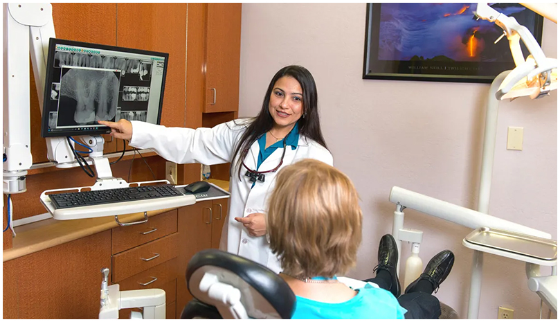 Dr. Saboowala reviewing a patient's digital X-ray on screen